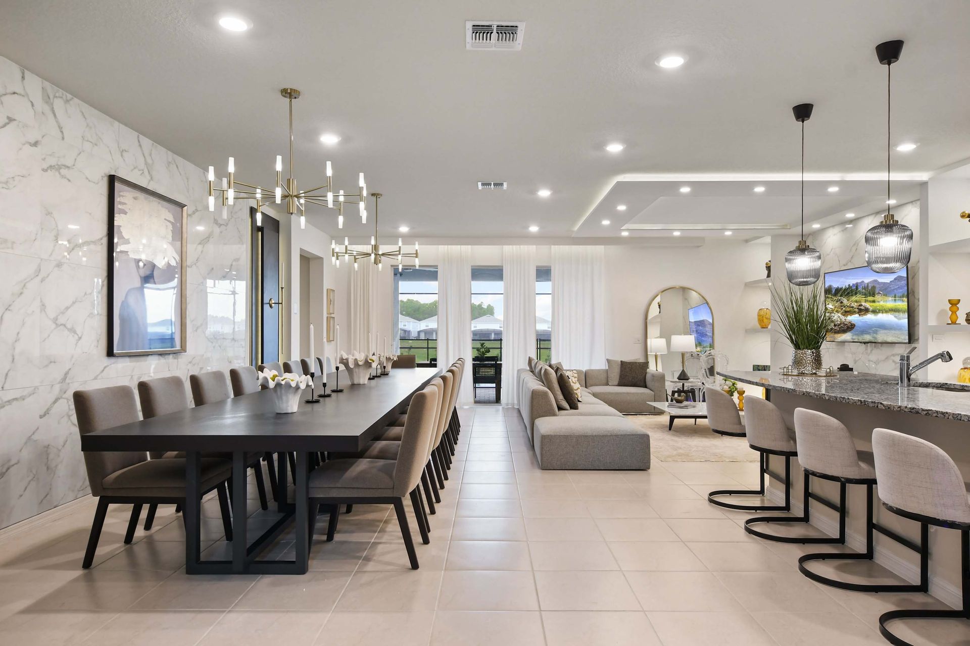 Elegant open-concept space with a 16-seat dining table and stylish modern design.