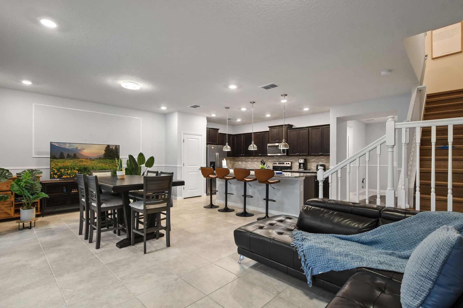Bright and open concept with kitchen, dining, and lounge perfect for entertaining.