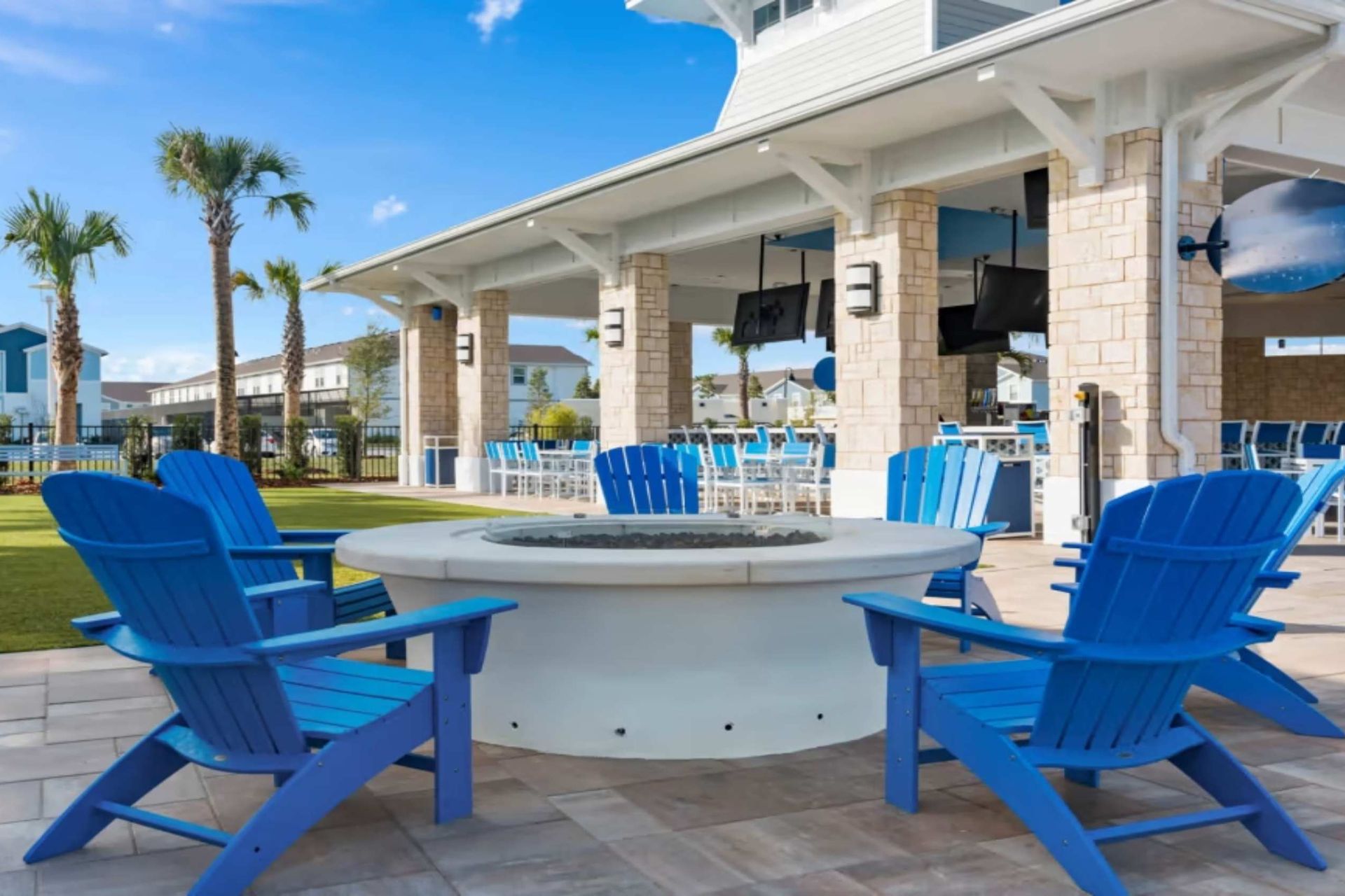 Relax around the fire pit with vibrant seating and sunny vibes.