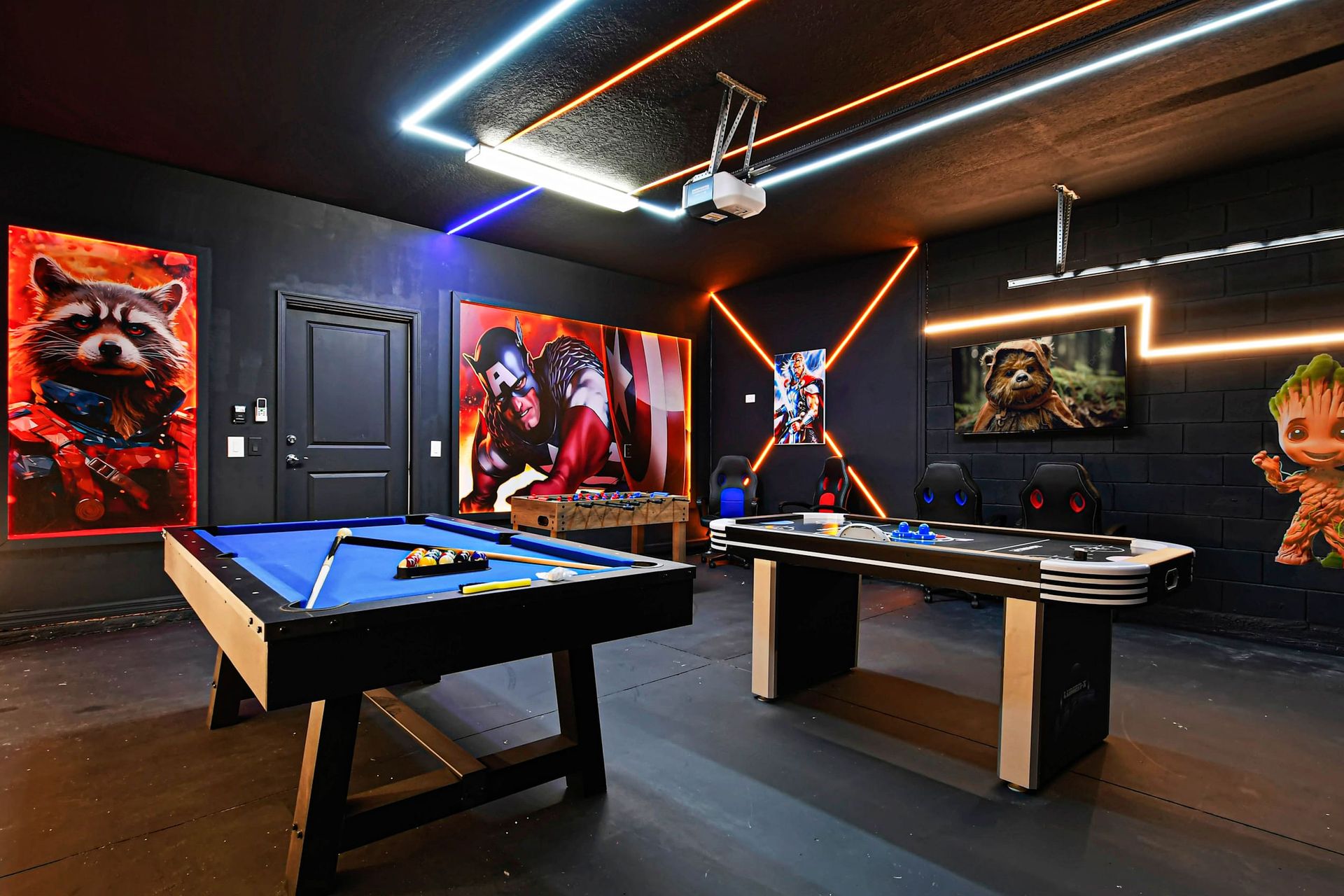 Vibrant hero-themed game room with pool, air hockey, foosball, and neon lights.