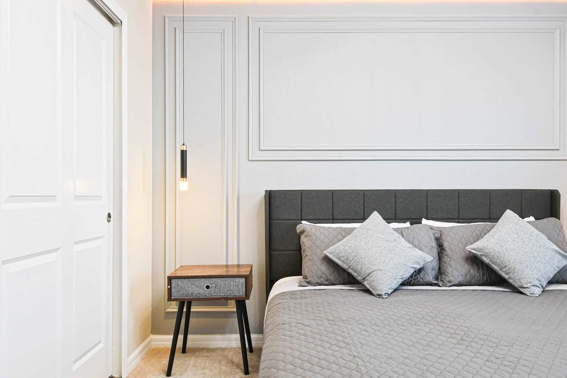 Modern king suite with sleek decor, cozy lighting, and a peaceful night’s sleep.