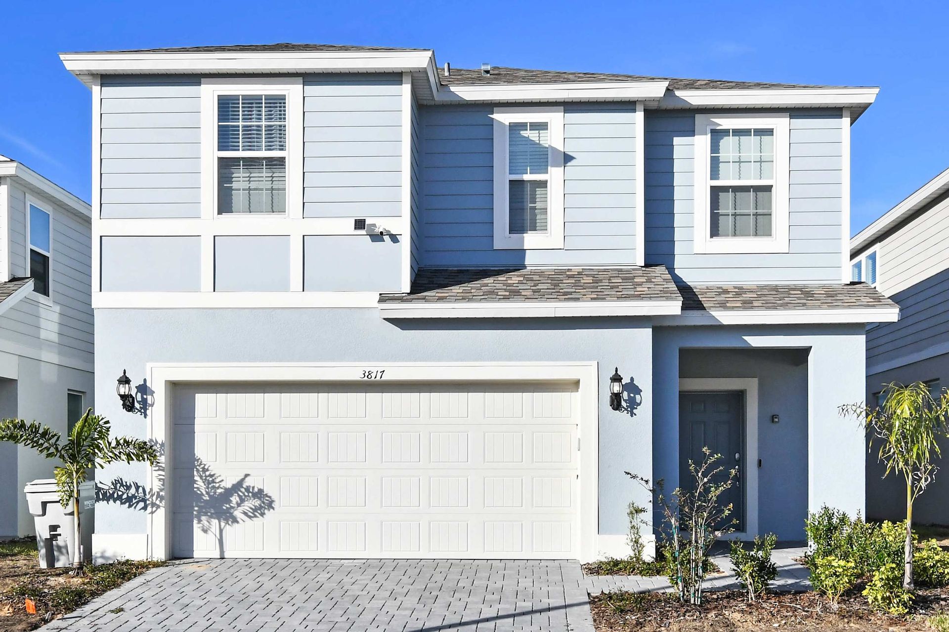 Modern 2-story getaway with garage, sleek exterior, and stylish family appeal.