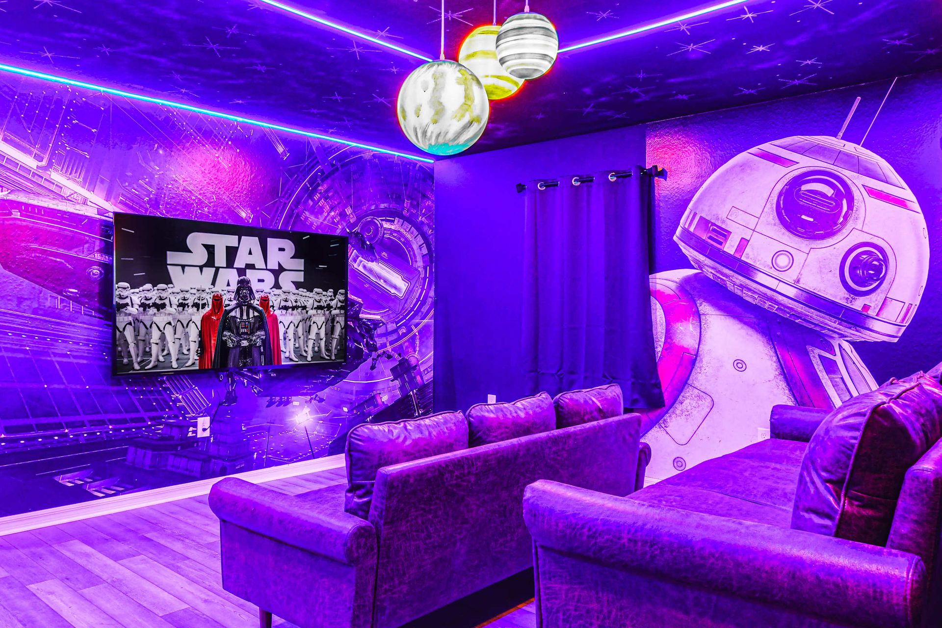 Immersive Star Wars theater room with galactic murals and cozy seating.