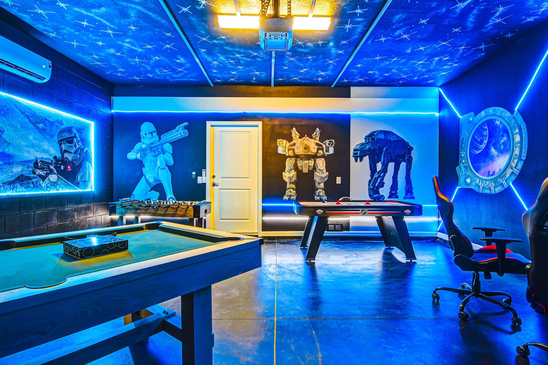 The game room is stylishly furnished with Star Wars theme with cool lights.