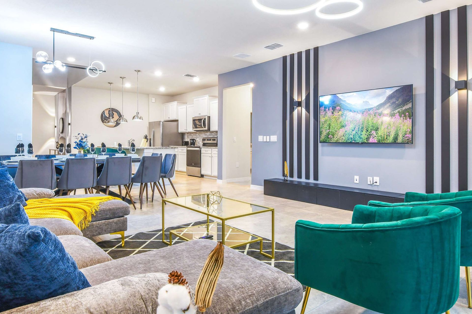 Stylish open-concept living with chic dining, modern kitchen, and cozy lounge.