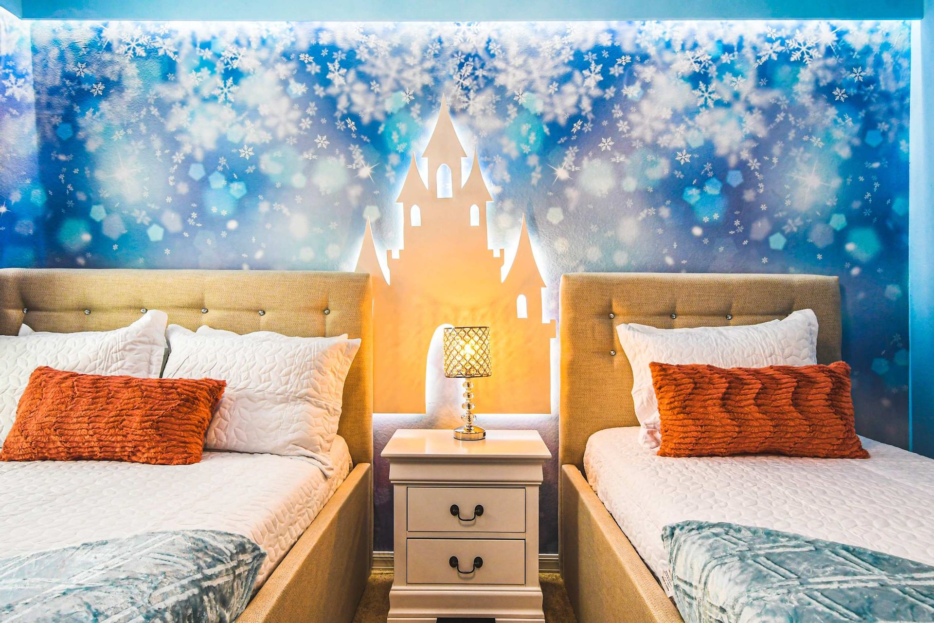 Whimsical Frozen-themed room with twin beds—perfect for your little royalty.
