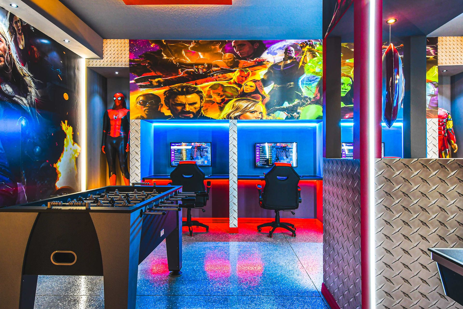 Action-packed Marvel game room with foosball, gaming stations, and heroic vibes!