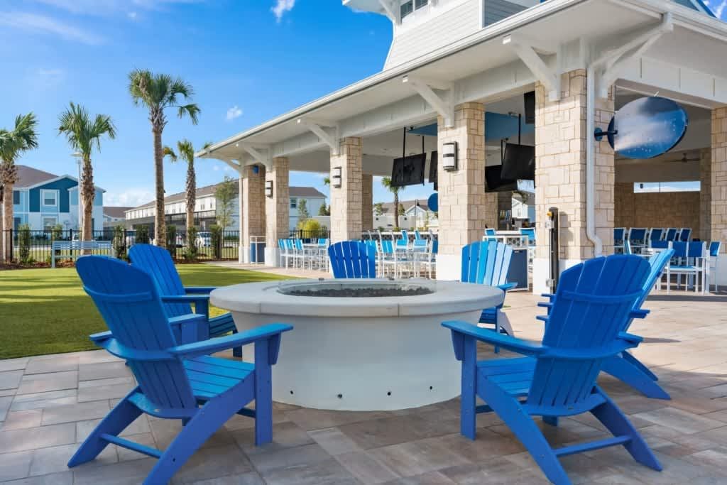 Relax around the fire pit with vibrant seating and sunny vibes.