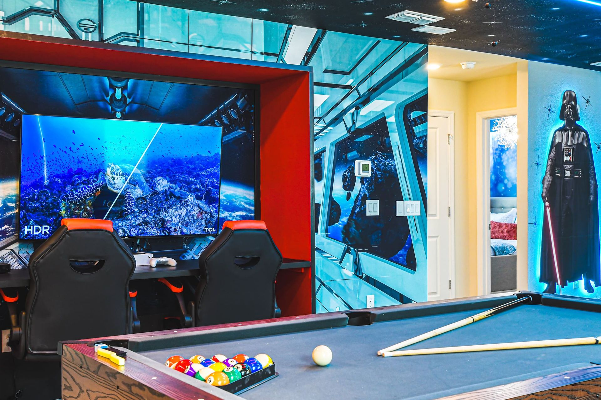 Dual gaming station and pool table in a Star Wars galaxy—fun from every corner!
