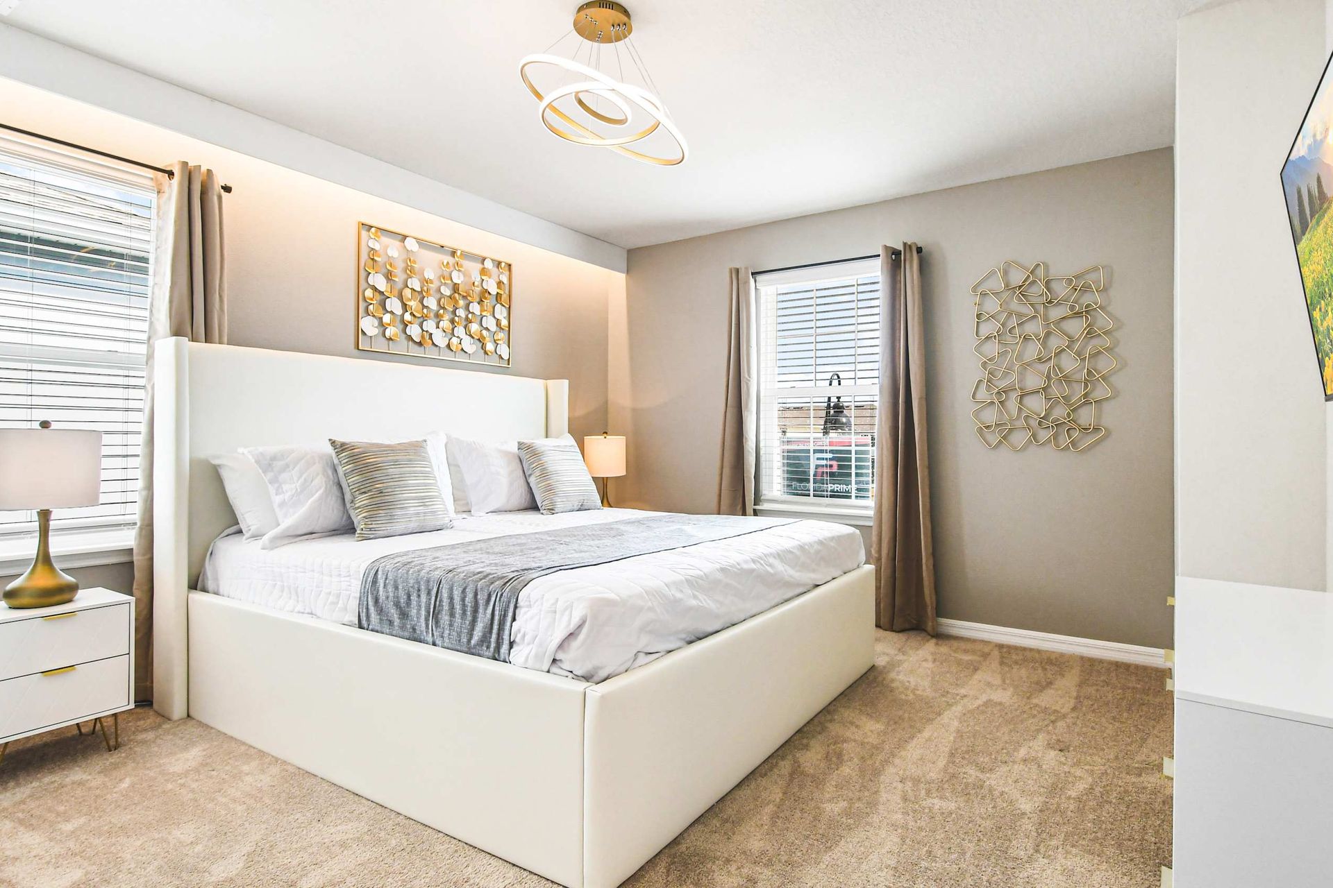 Bright and elegant bedroom with king bed and modern flair—rest in luxury and style!