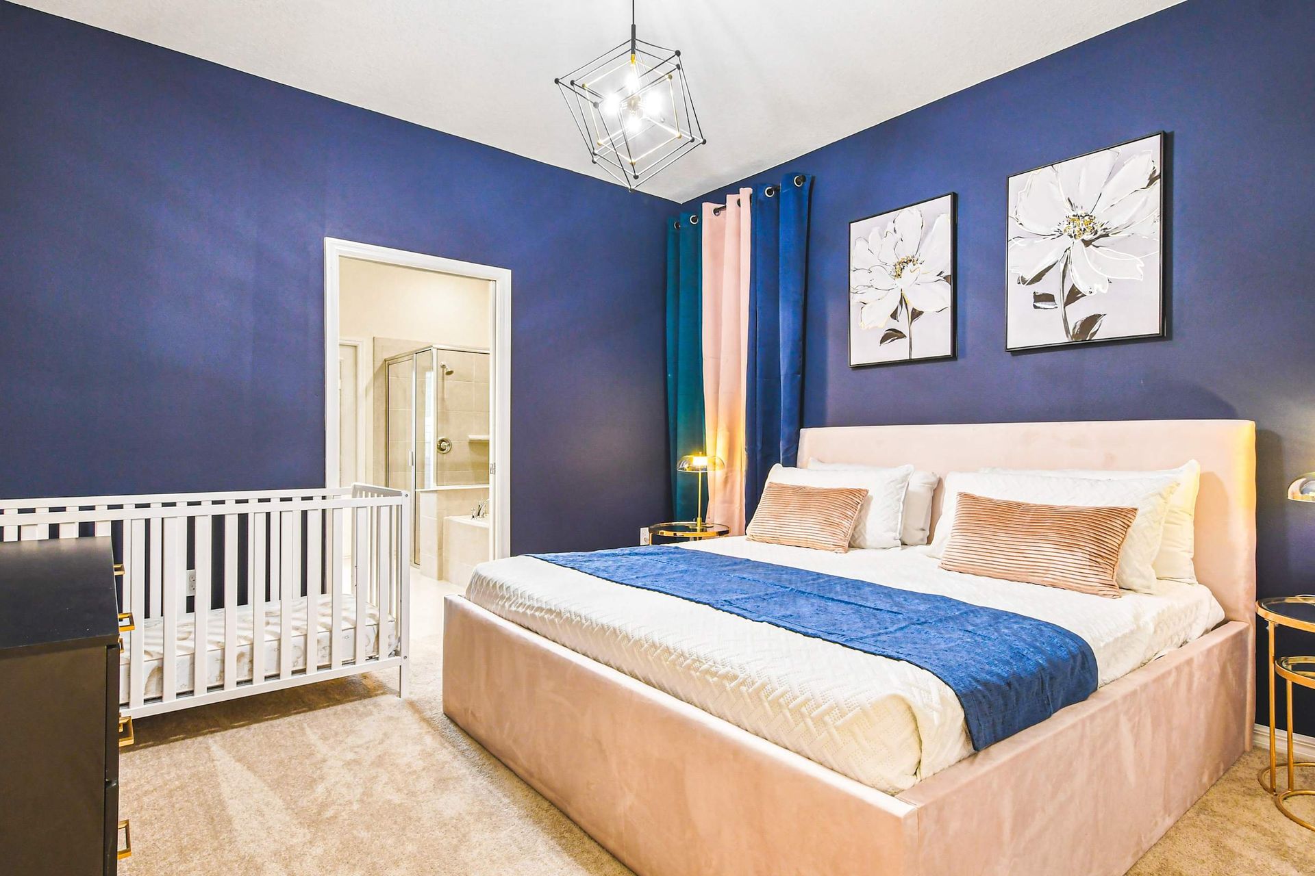 Chic family suite with king bed, crib, and ensuite—comfort and style for all.