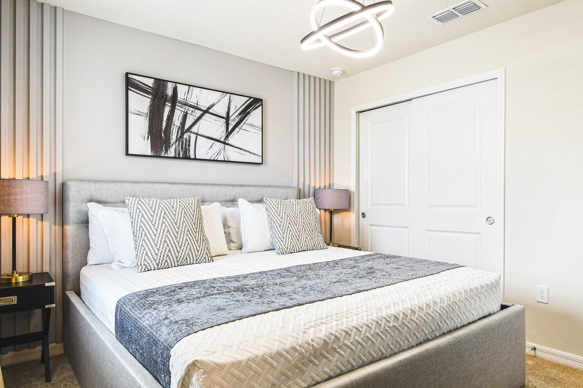 Modern king suite with sleek design, luxe linens, and relaxing ambient lighting.