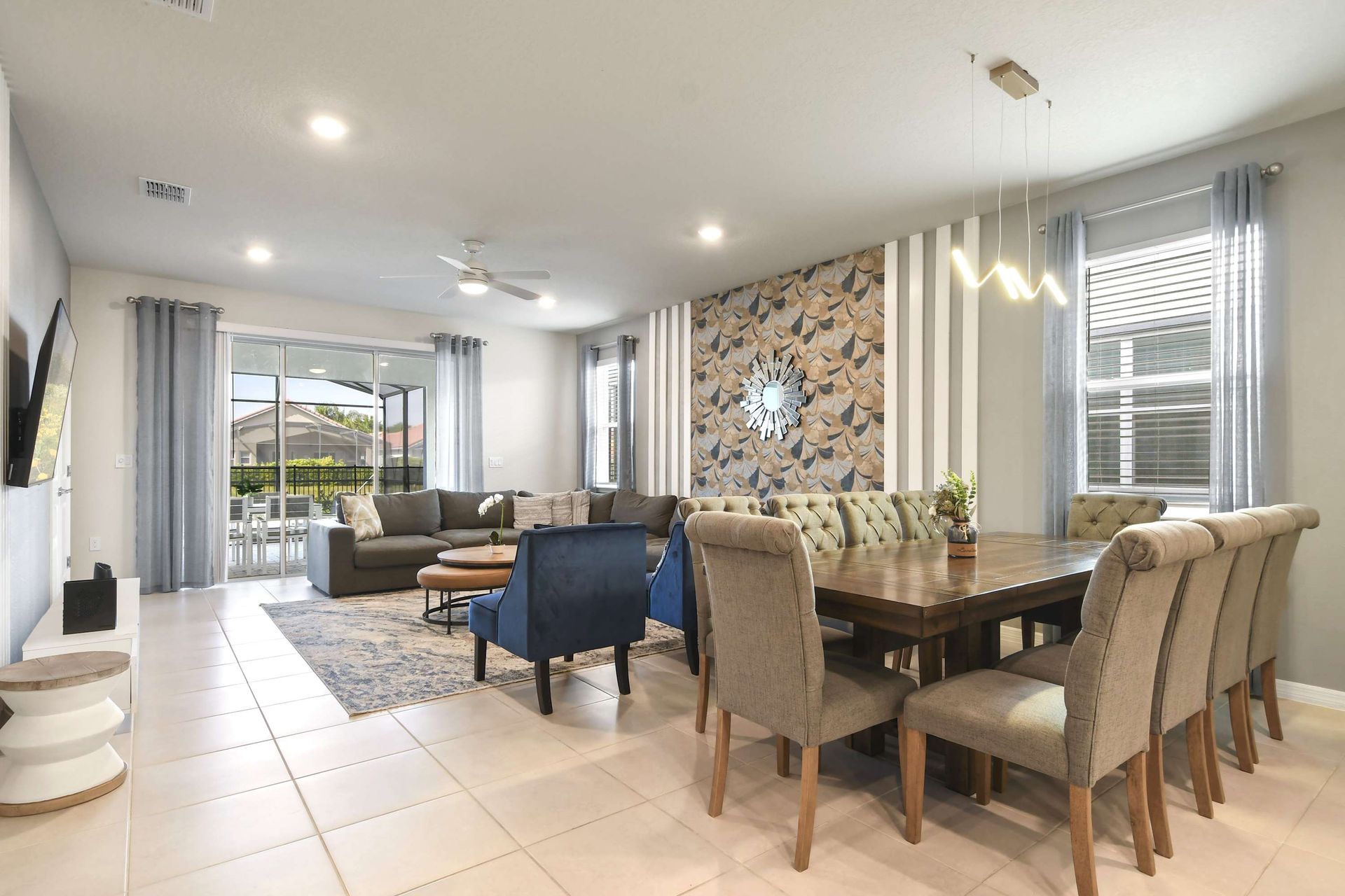 Bright open-plan layout with chic decor, indoor dining, and patio access.