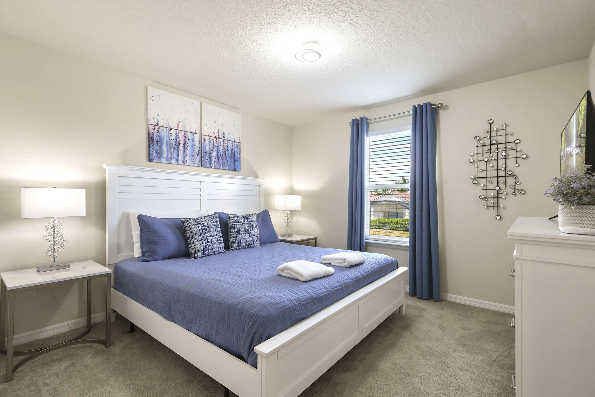 Relax in this stylish king suite with natural light, modern decor, and a TV.