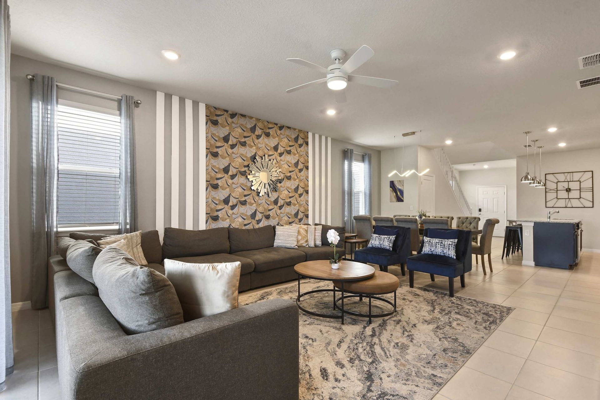 Spacious designer living area with elegant seating, dining, and open kitchen flow.