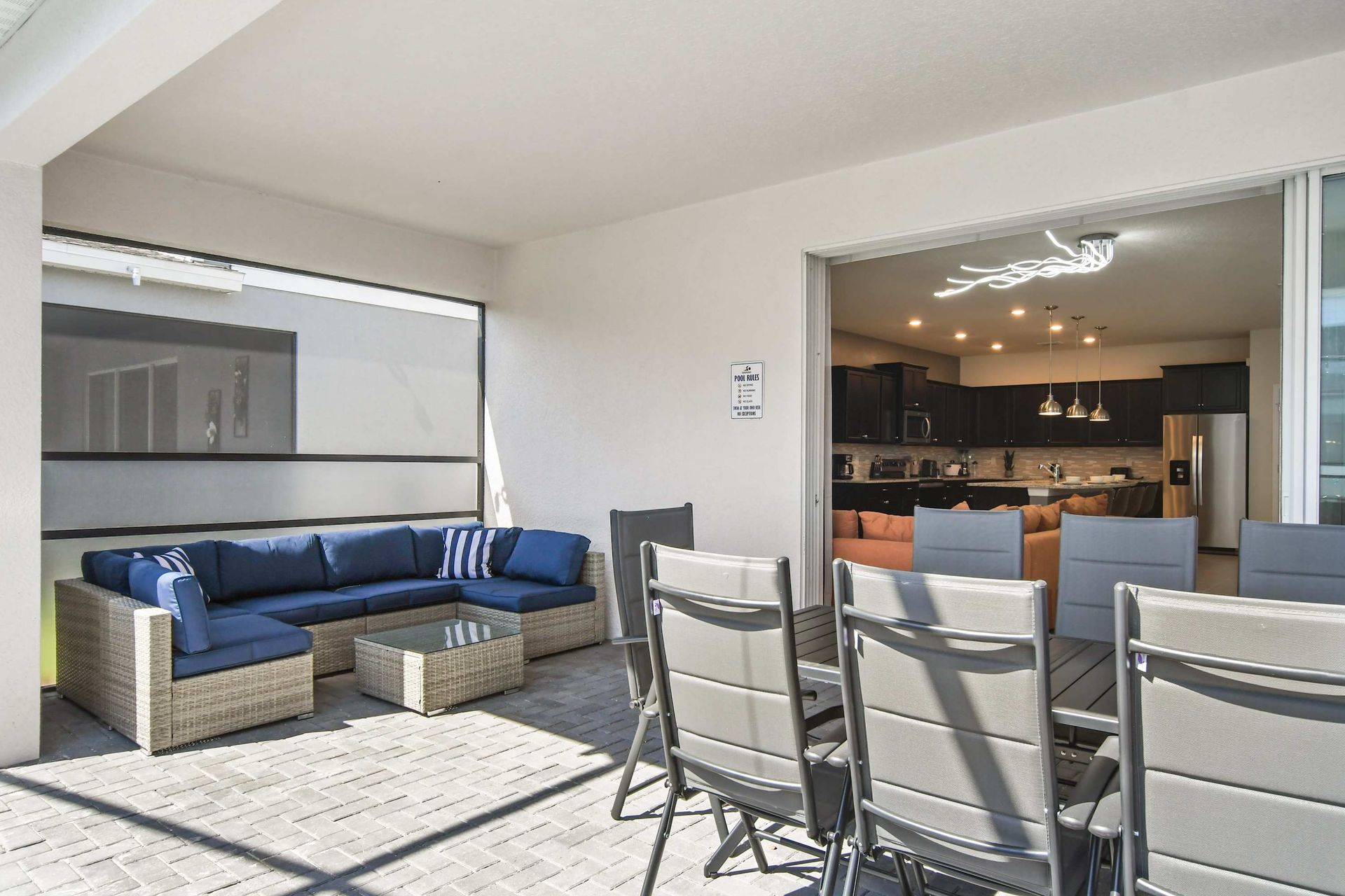 Relax in the cozy outdoor lounge and dining area, just steps from the kitchen.