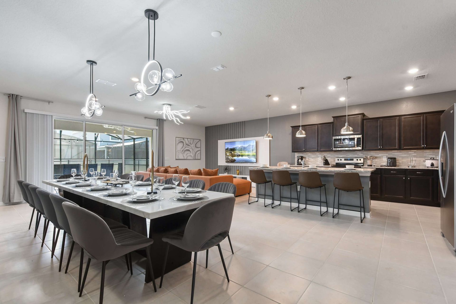 Dine in style with this spacious open-plan dining area, featuring modern decor, elegant lighting, and plenty of room for family meals and gatherings.