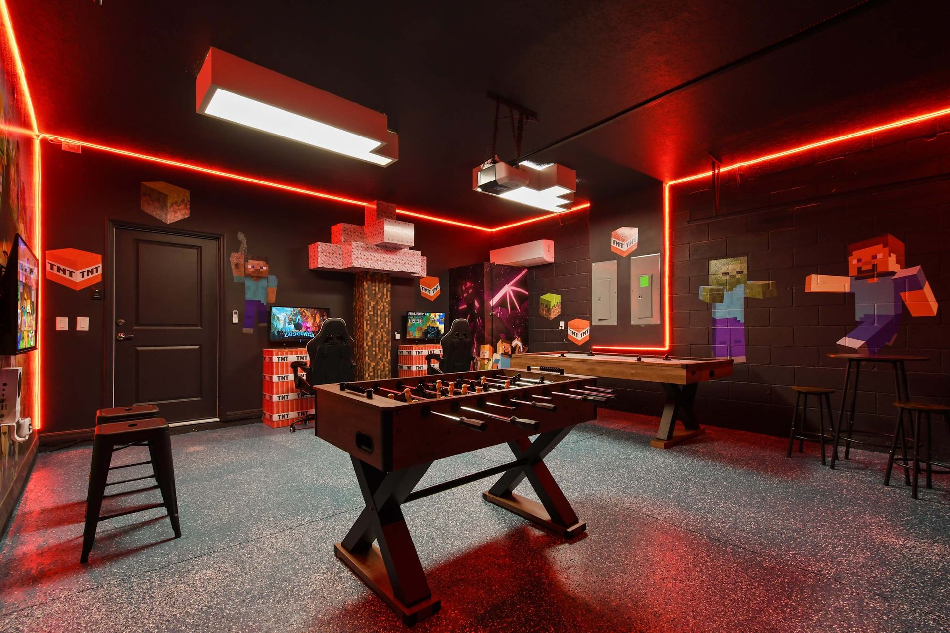 Enjoy endless entertainment in this vibrant game room, featuring foosball, gaming stations, and a Minecraft-themed design to keep the fun going for hours.