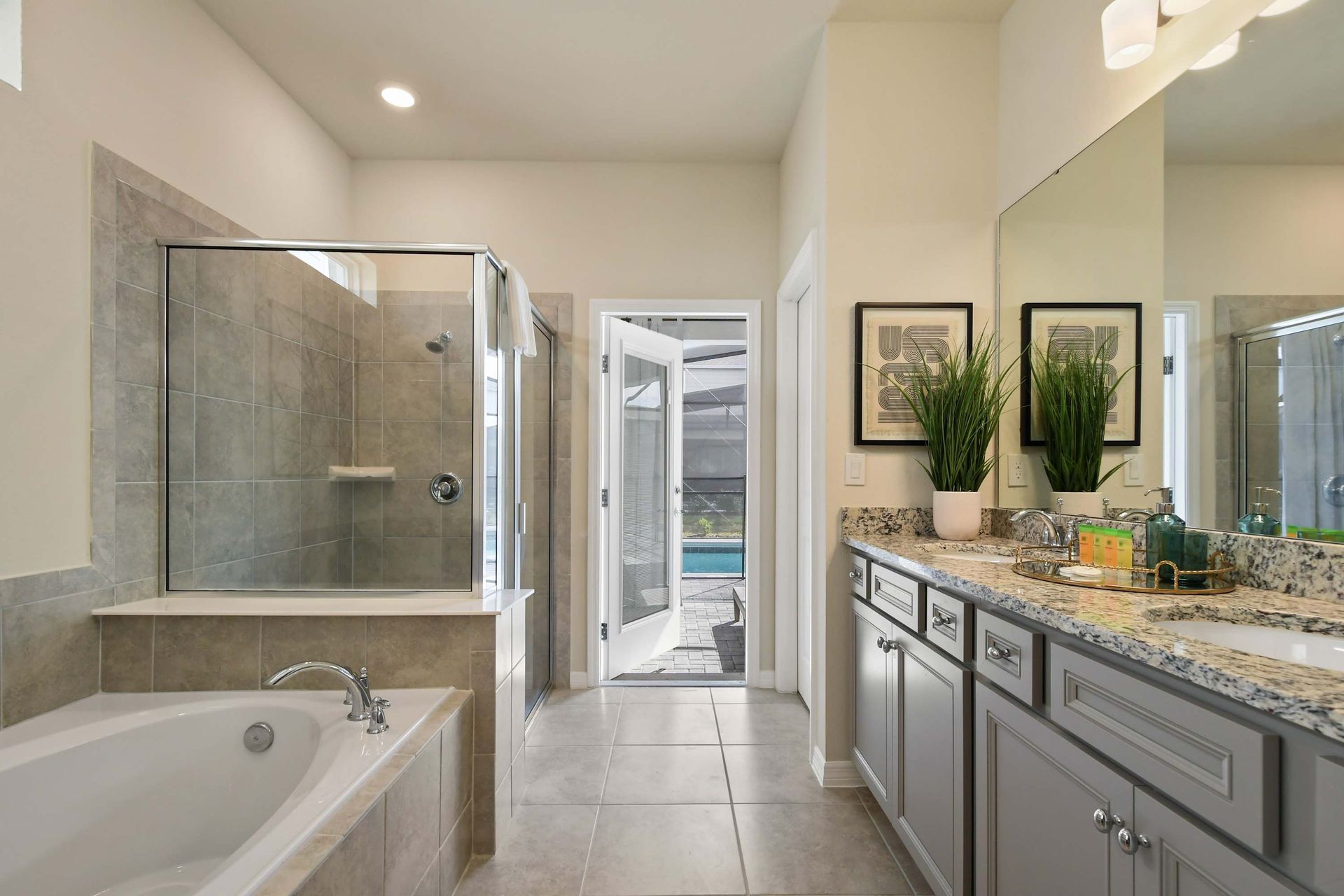 Elegant ensuite with walk-in shower, soaking tub, and direct poolside access.