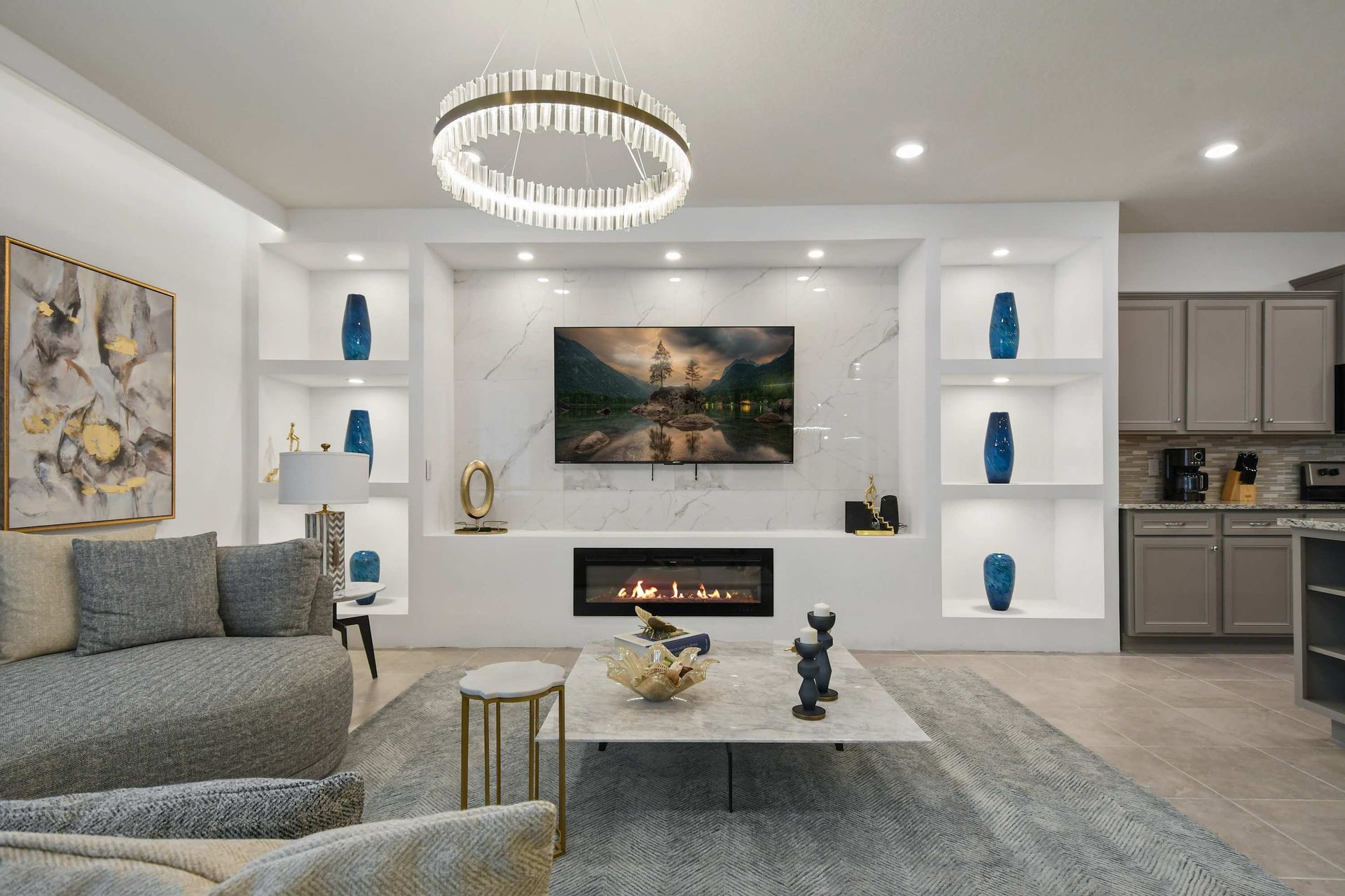 Sophisticated lounge with marble fireplace, smart TV, and curated modern décor.