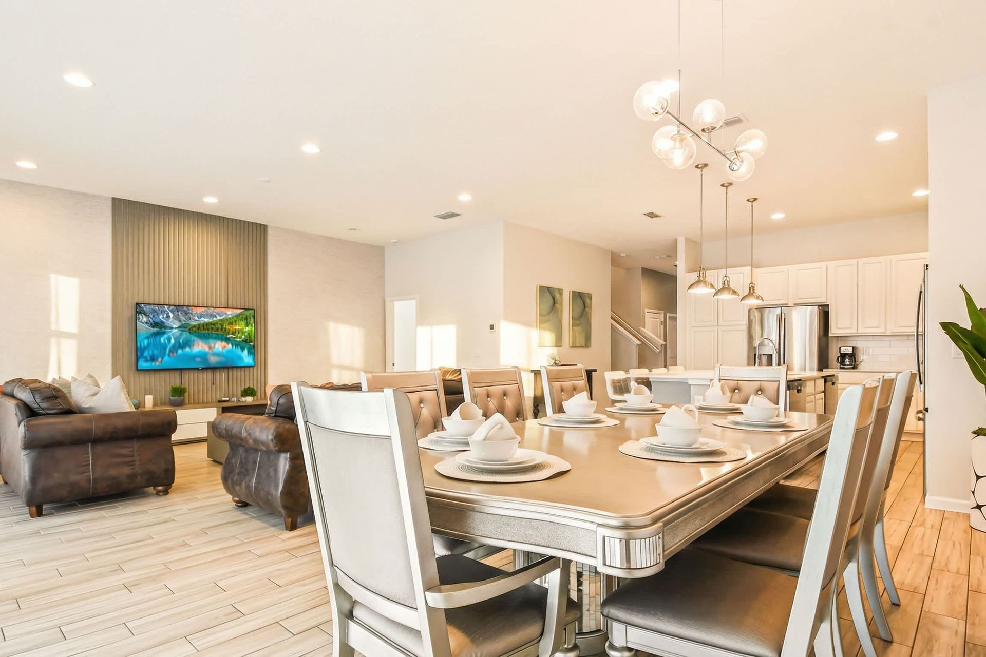 Stylish open-concept kitchen, dining, and living area perfect for group stays.
