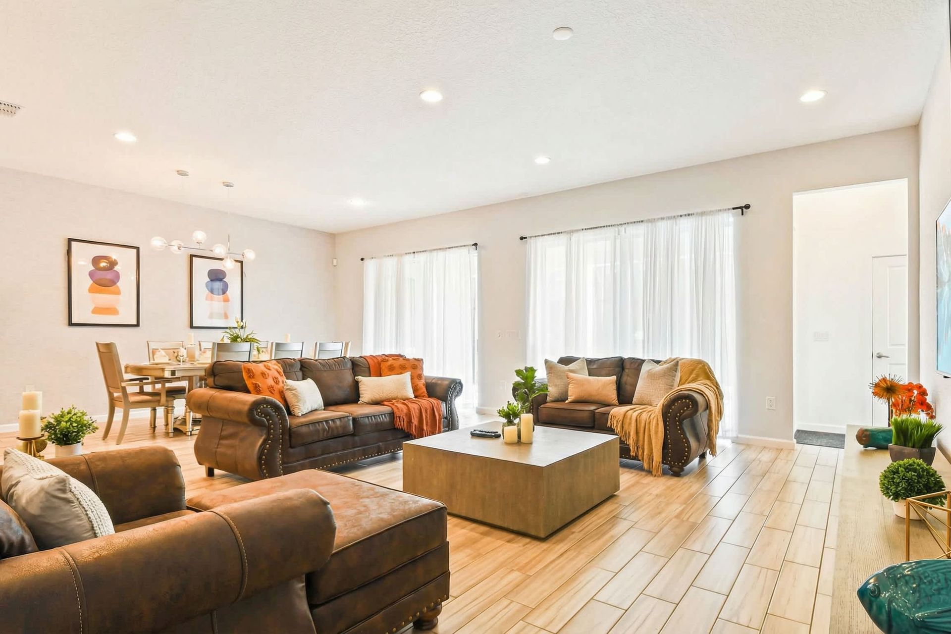 Spacious open-concept living and dining with stylish decor and natural light.
