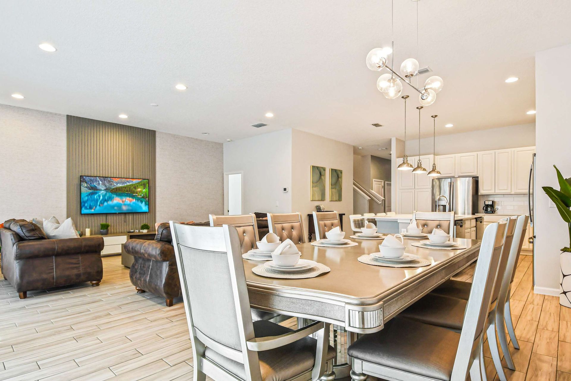 Stylish open-concept kitchen, dining, and living area perfect for group stays.
