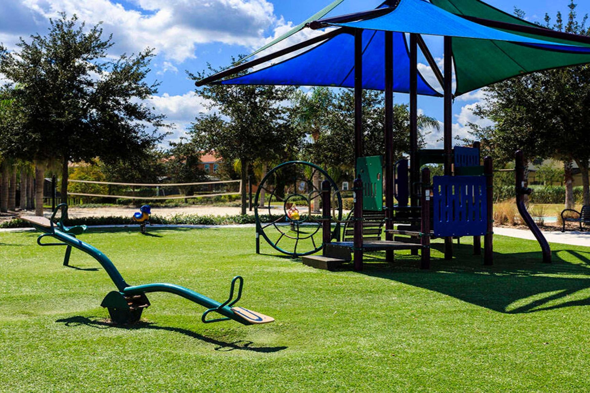 
Family fun! Shaded playground & nearby volleyball court await!