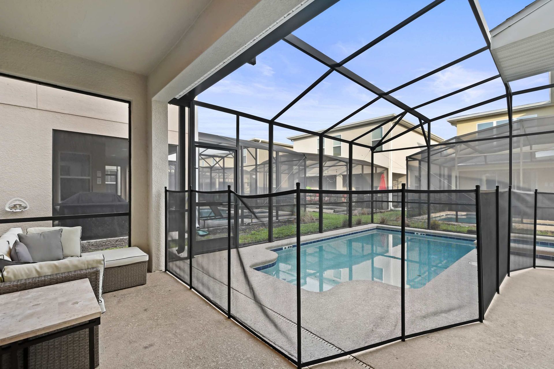 Screened-in pool and lounge area perfect for relaxing days and evening swims.