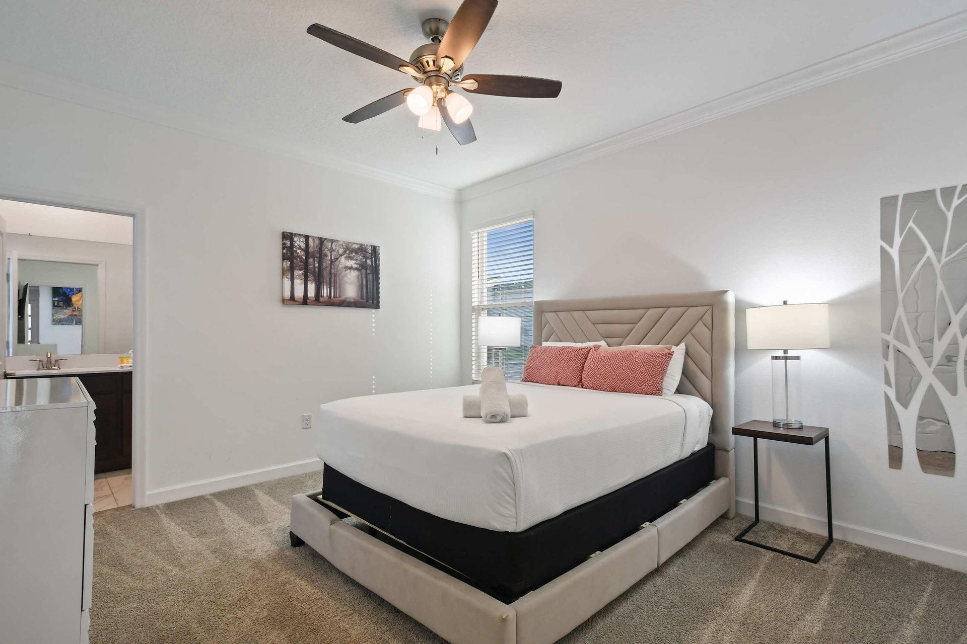 Relax in a serene bedroom retreat with plush bedding and private ensuite bath.