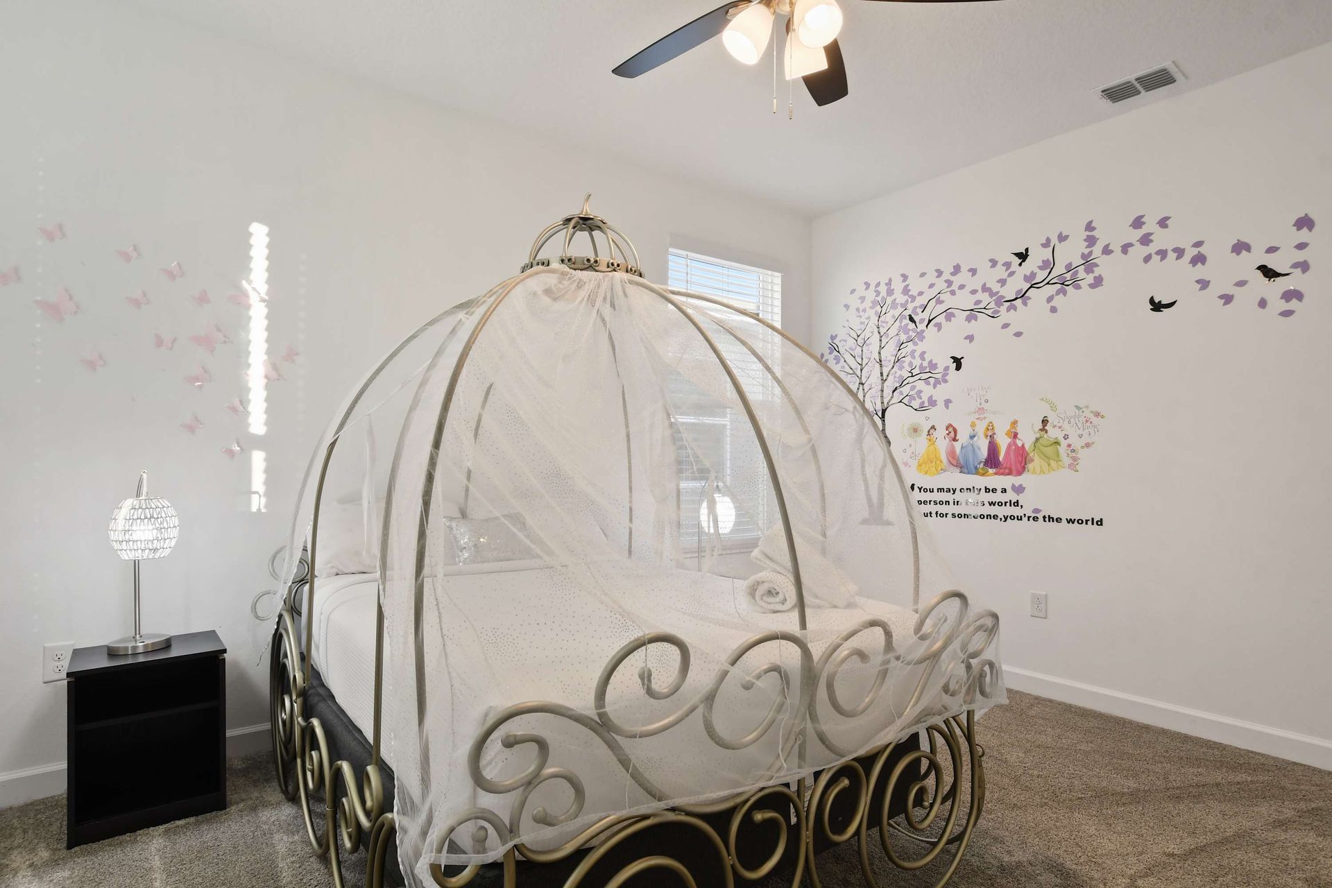 Whimsical princess-themed room with carriage bed, perfect for magical stays.