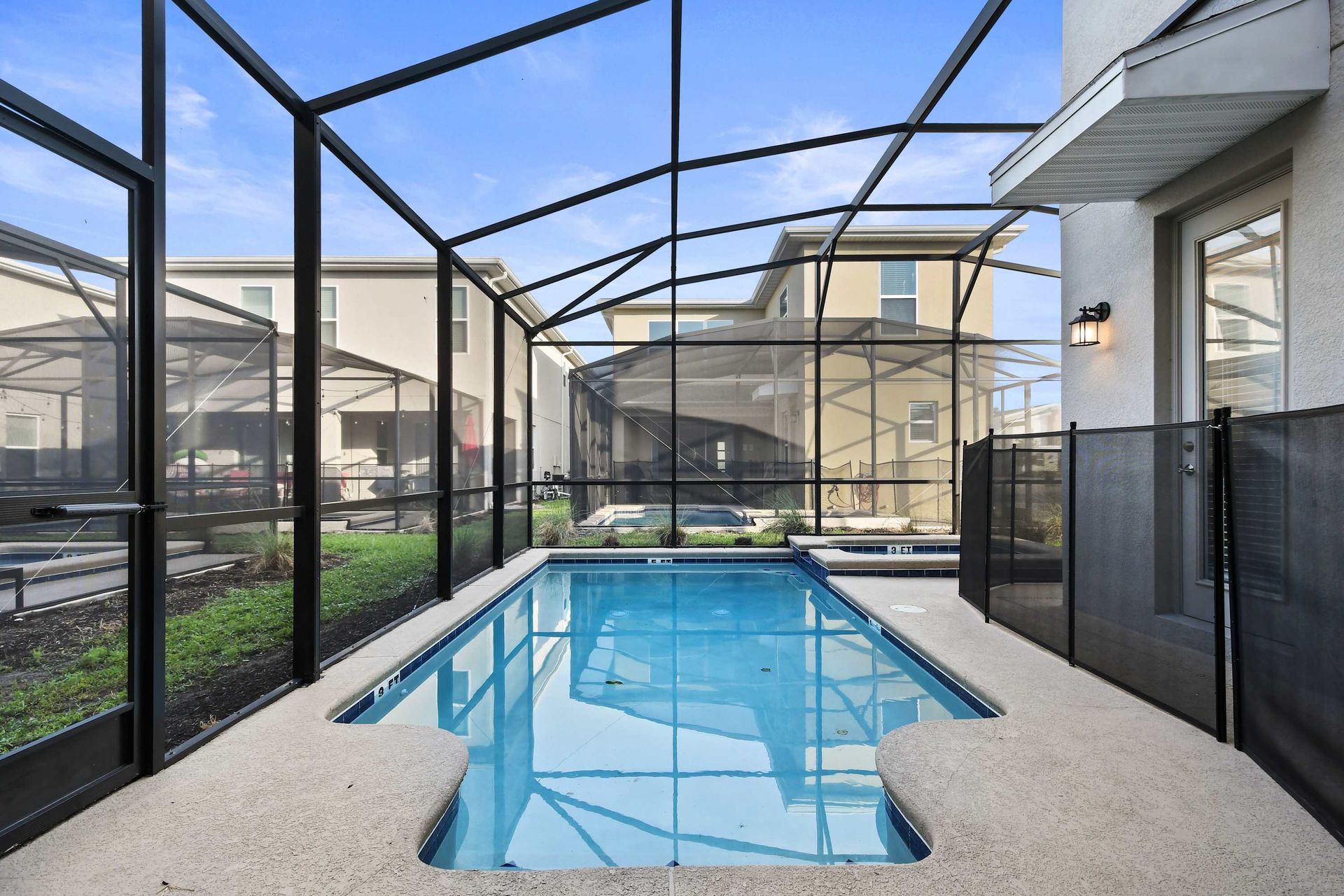 Crystal-clear private pool in a screened enclosure—your oasis for sun and fun.