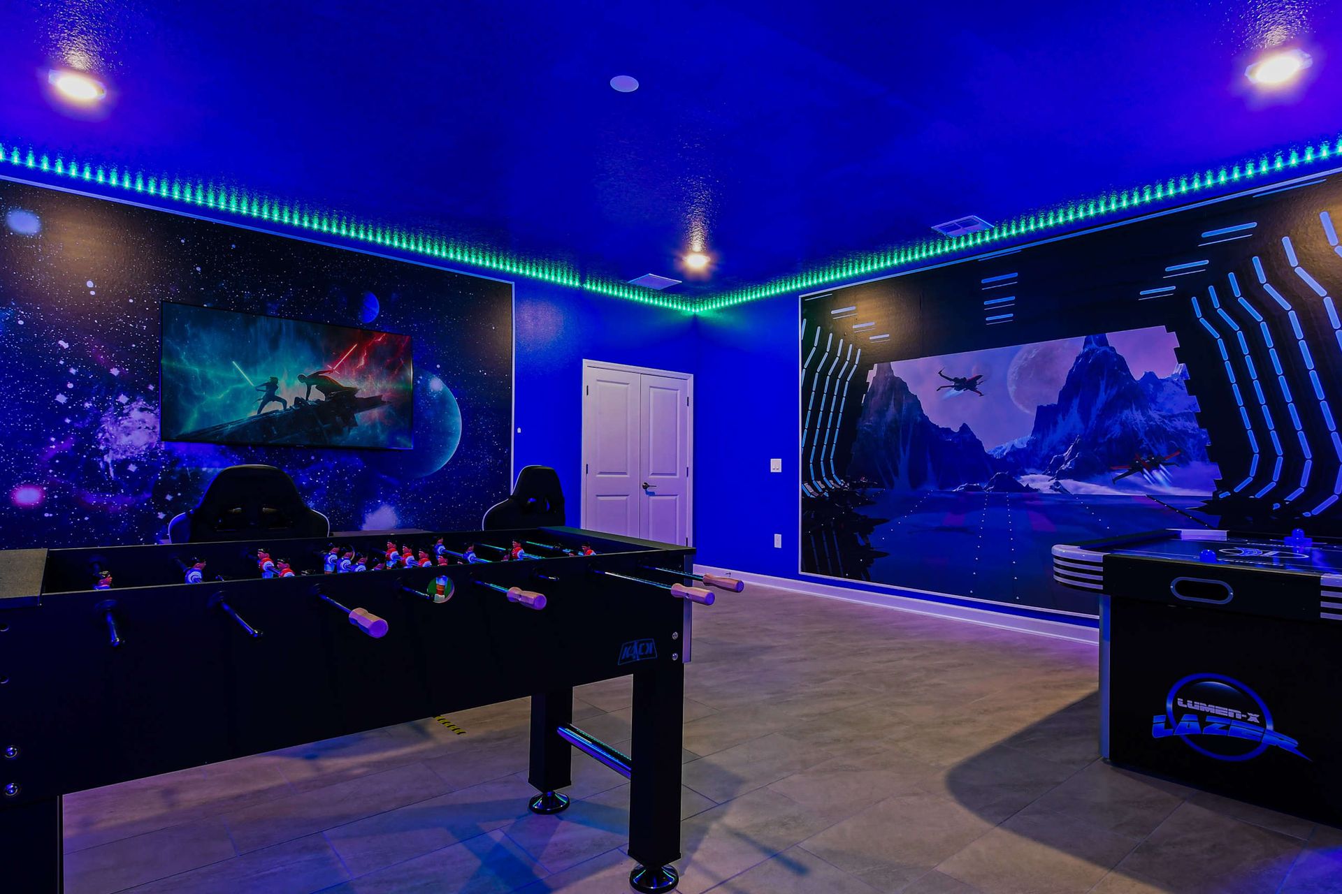 Next-level galaxy game room with foosball, air hockey, and cinematic space vibes.