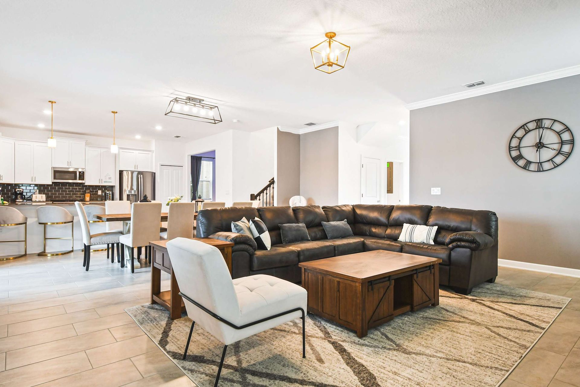 Spacious living room area with cozy sofa, perfect for family reunion.