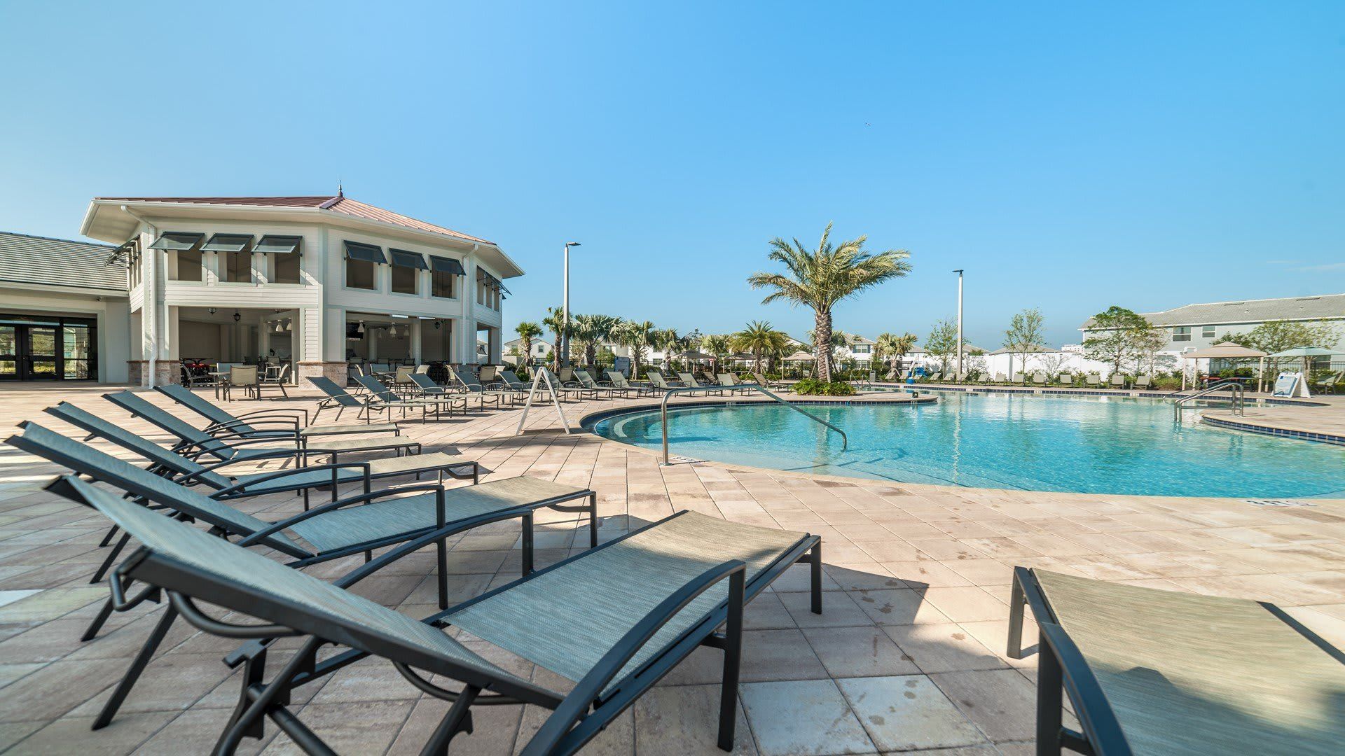 Lounge in style by the resort-style pool under sunny skies and swaying palms!
