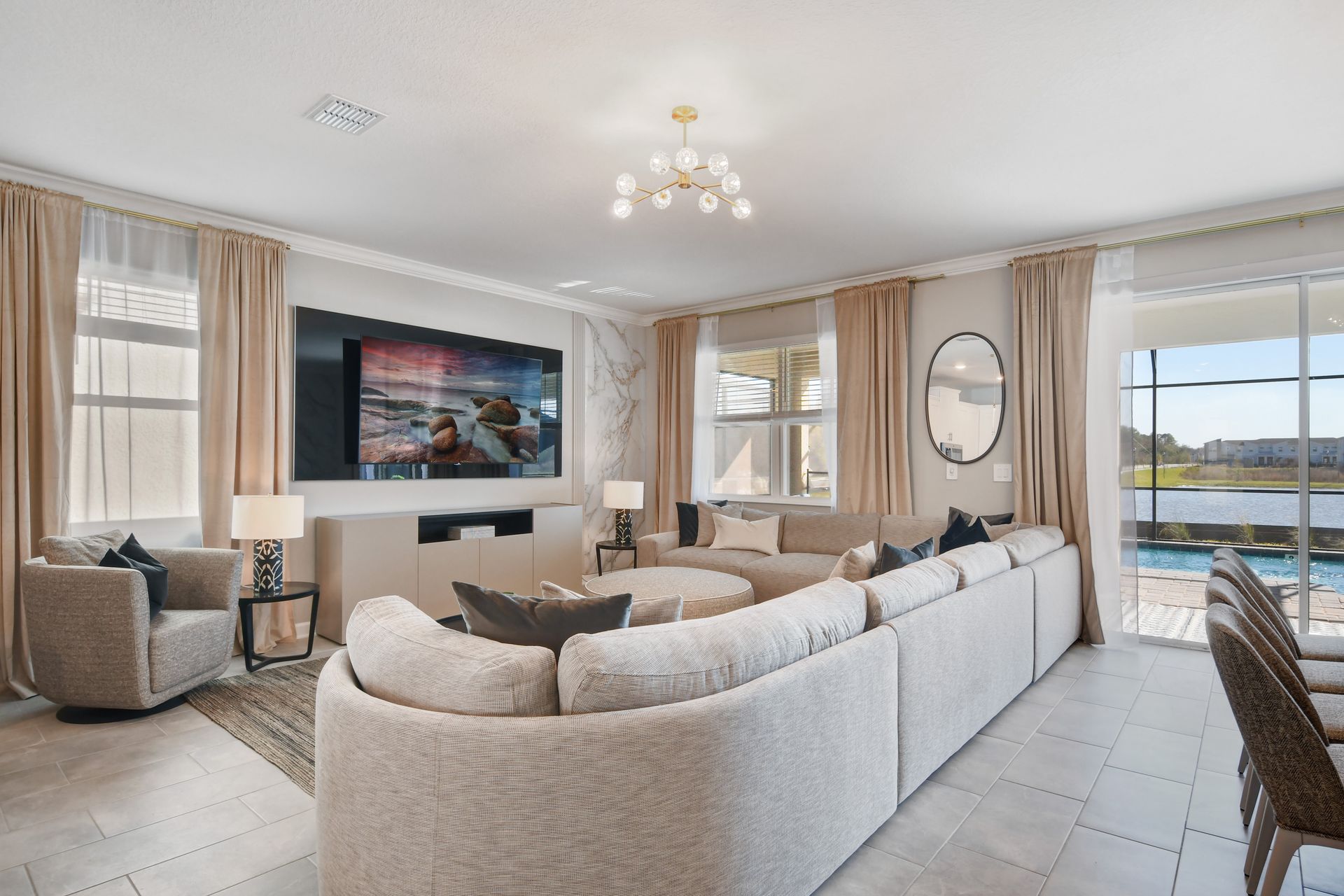 Gather with family and friends in our spacious living area. Featuring comfortable seating, a large flat-screen TV, and modern decor.