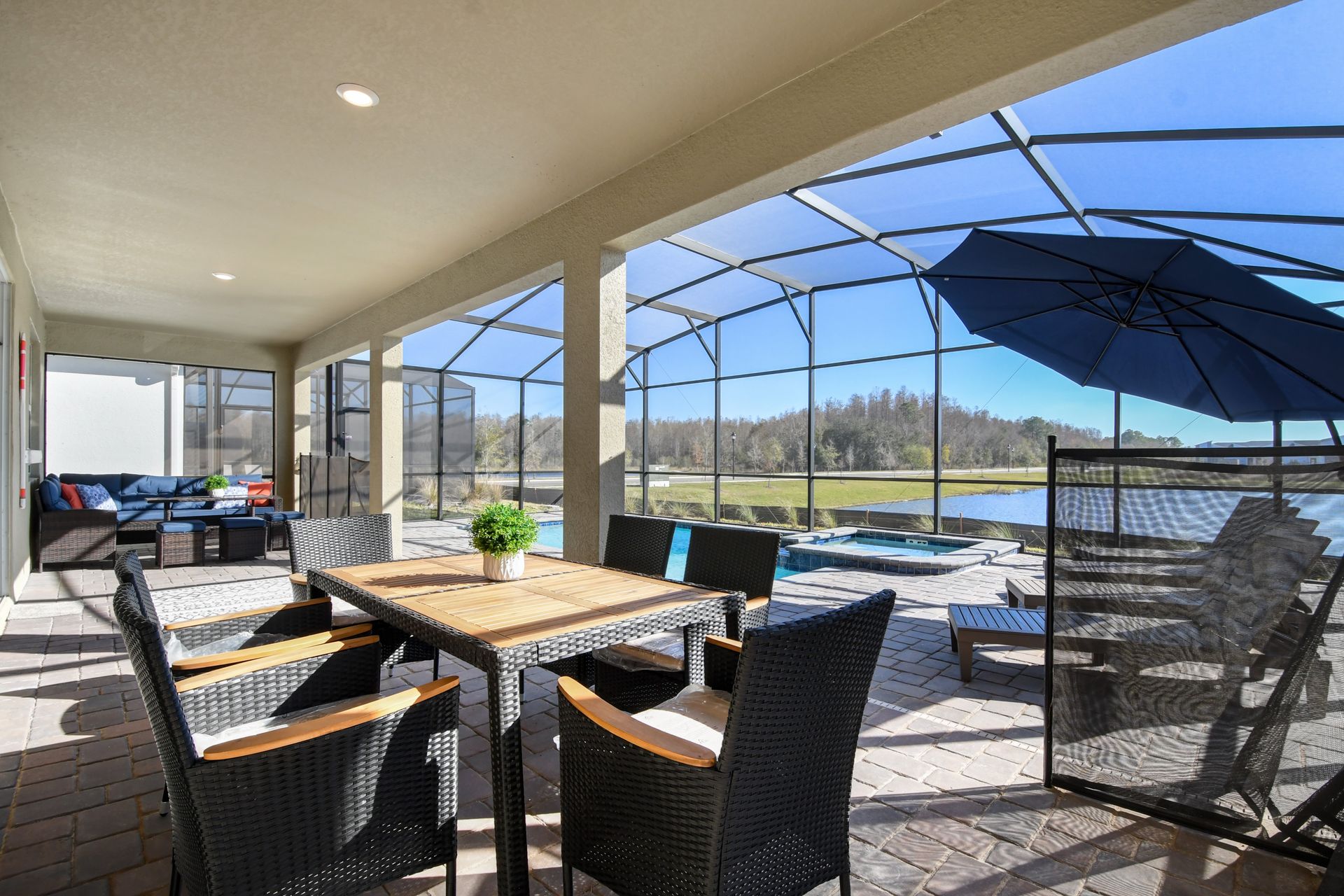 Enjoy alfresco dining and lakeside lounging in this spacious screened-in patio retreat.