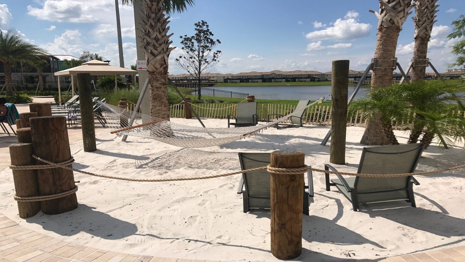 Unwind in the tranquility of on beach chairs, nestled in the sand overlooking the picturesque lake, offering you a serene escape to relax and rejuvenate.