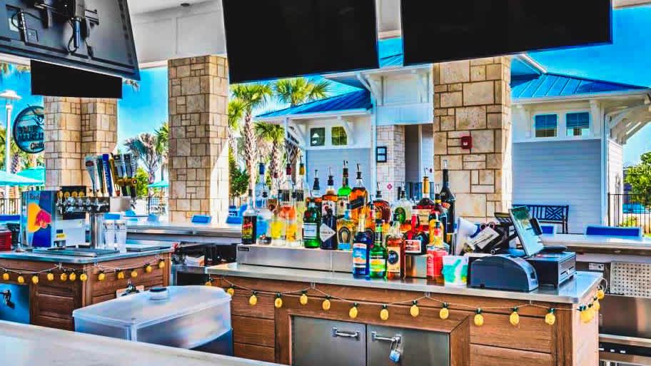 Poolside tiki bar with flat screens, tropical drinks, and a laid-back island vibe!
