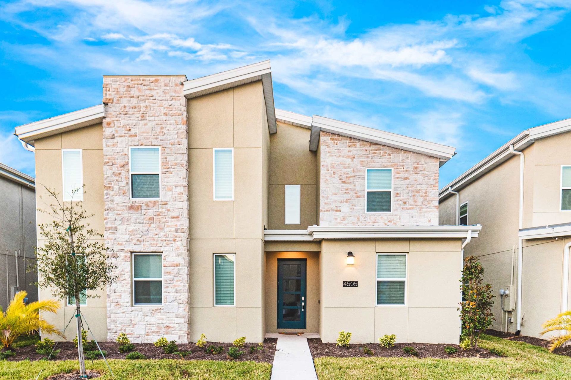 Step into a modern masterpiece that seamlessly blends contemporary design with timeless charm, featuring strategic brick touches that add character and warmth to the sleek aesthetic.