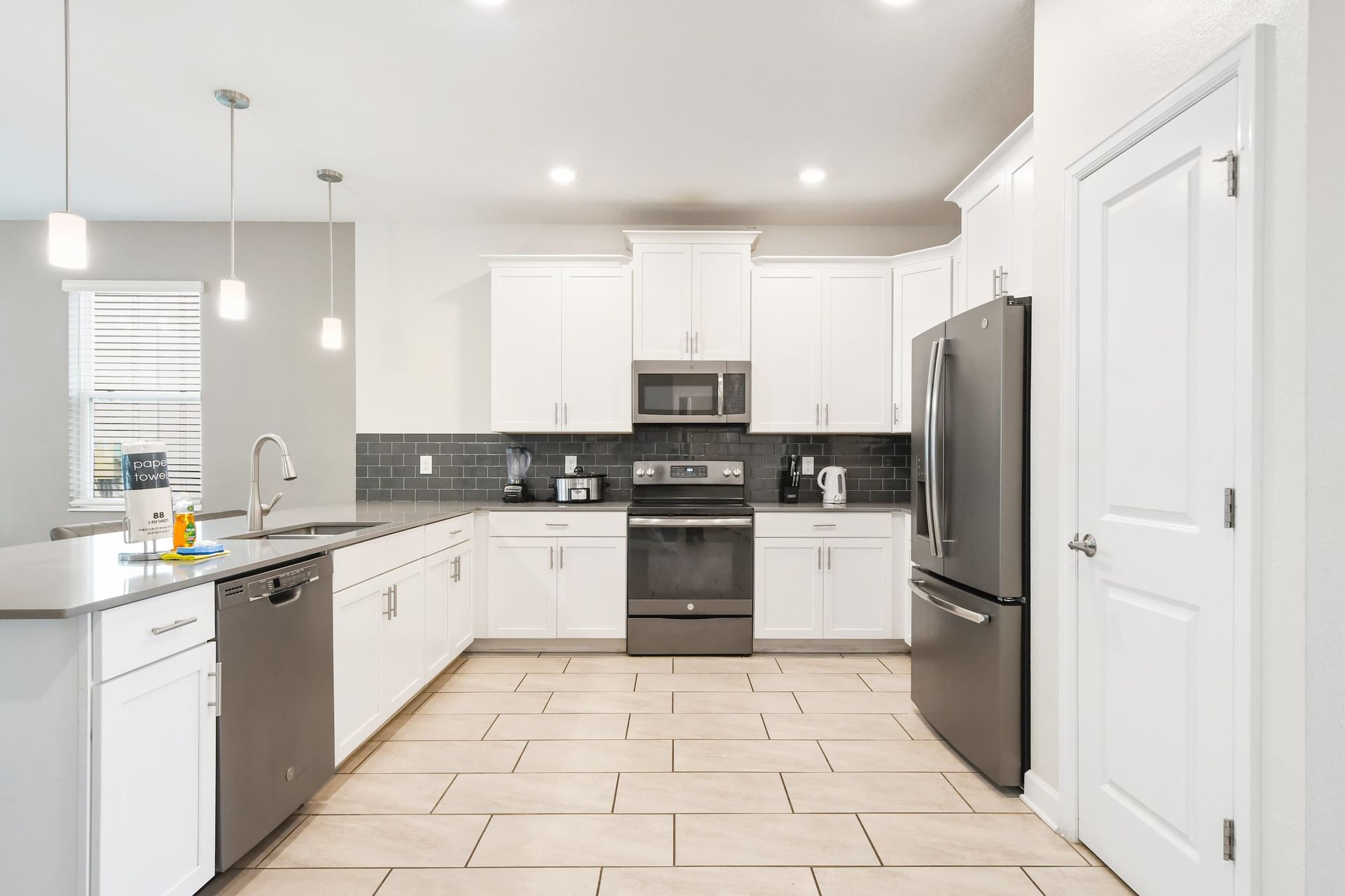 Modern kitchen with stainless steel appliances and sleek design!