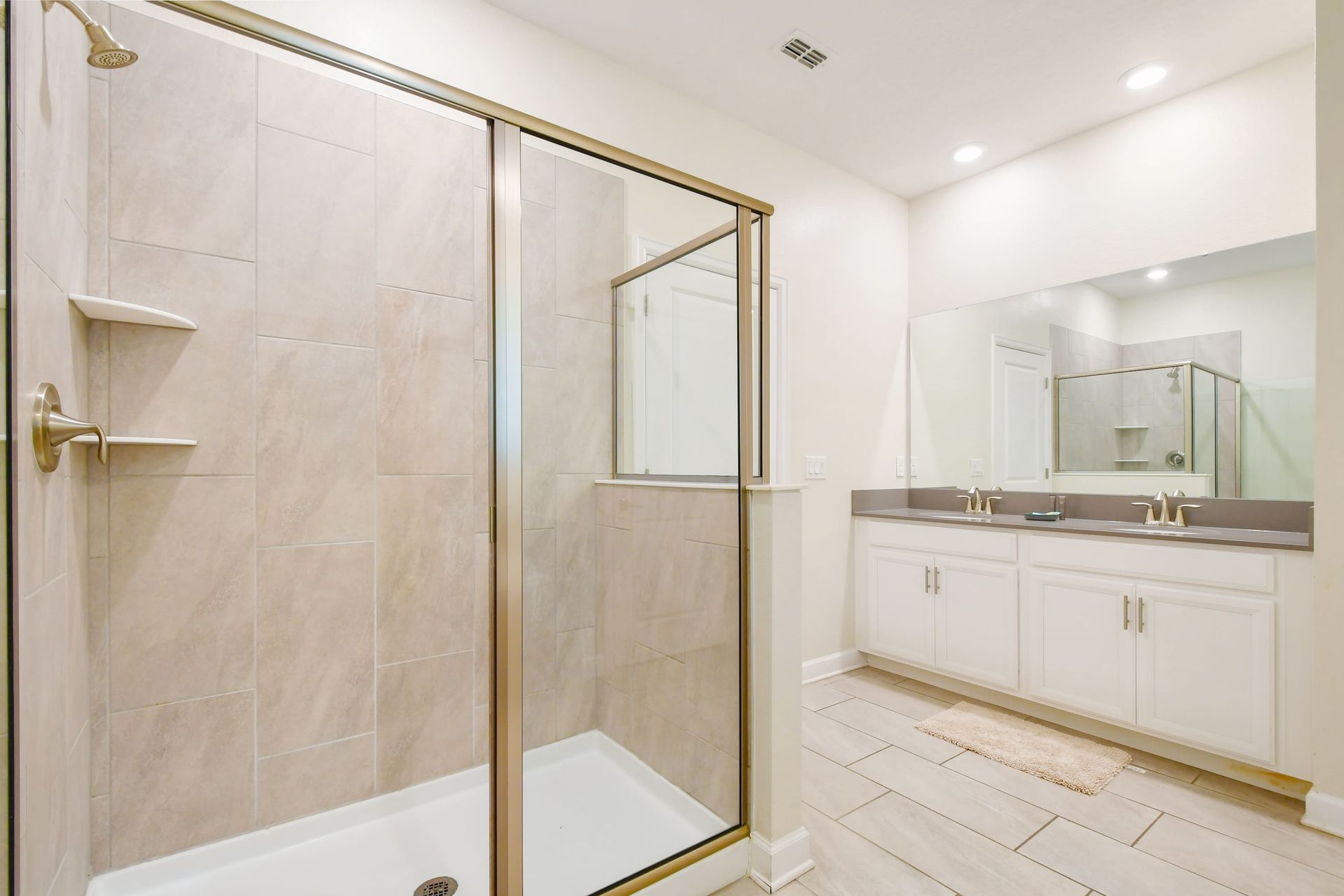 Spacious bathroom with walk-in shower and double vanity sinks!