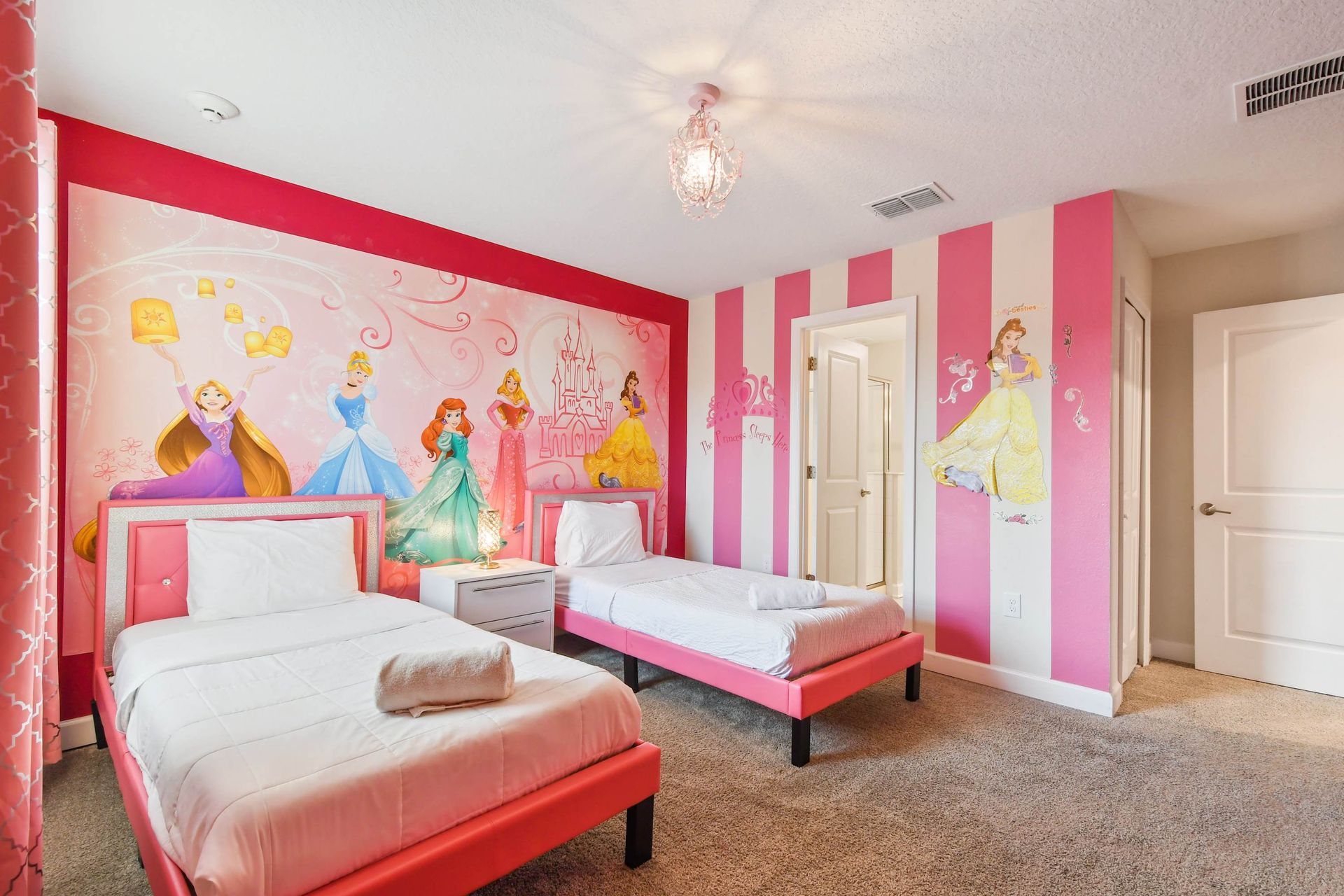 Princess-themed bedroom with twin beds, perfect for little royals!