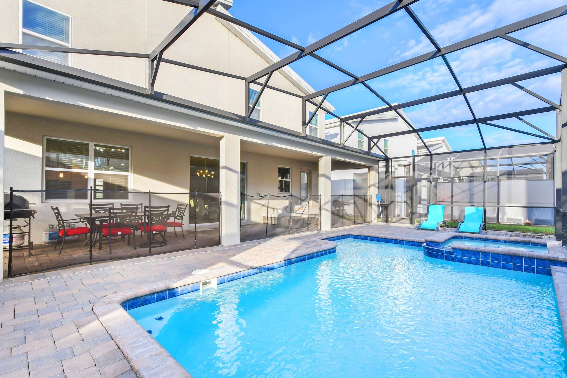 Spacious patio with dining, lounging area, and private pool.