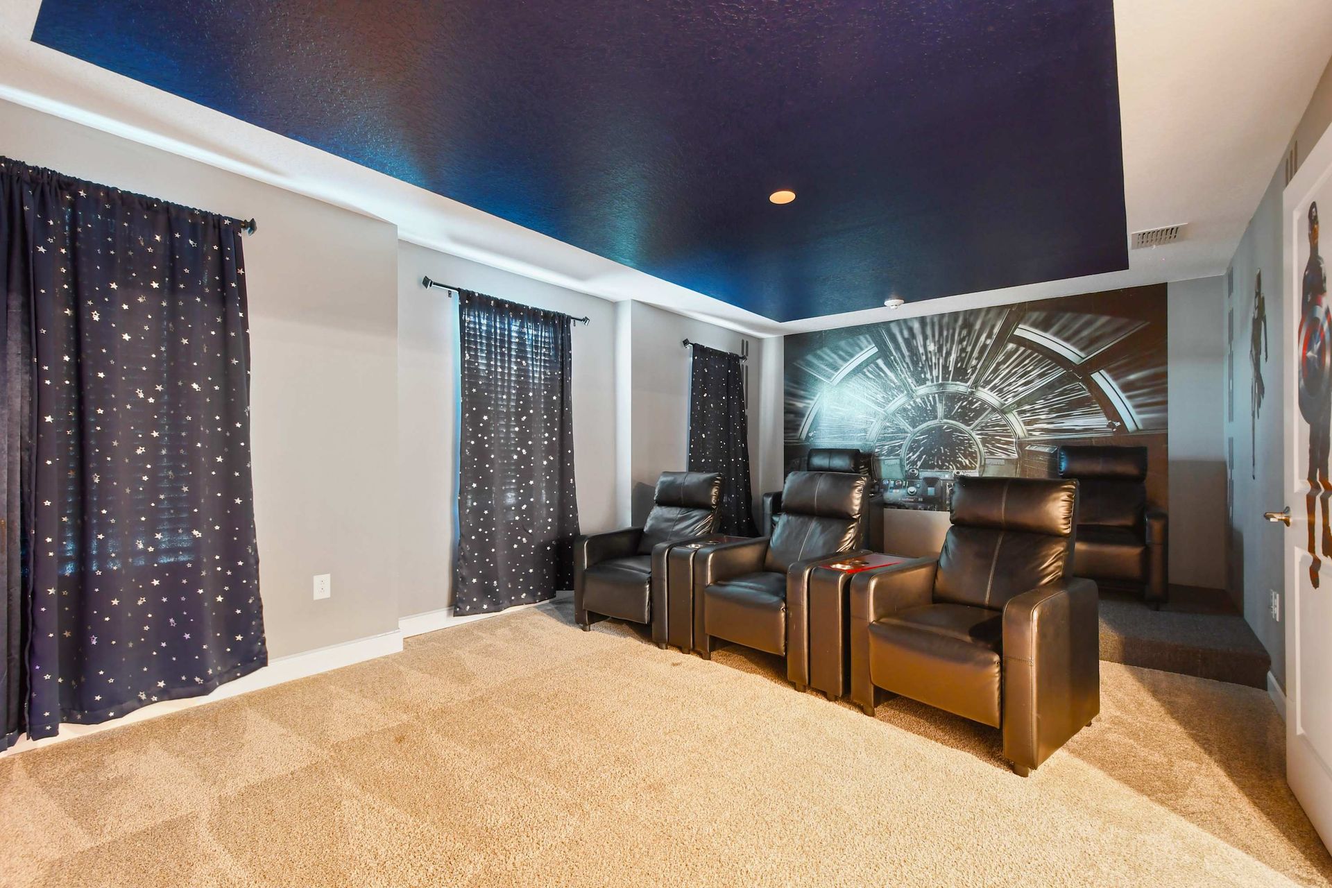 Star-themed theater room with comfy recliners for movie nights!