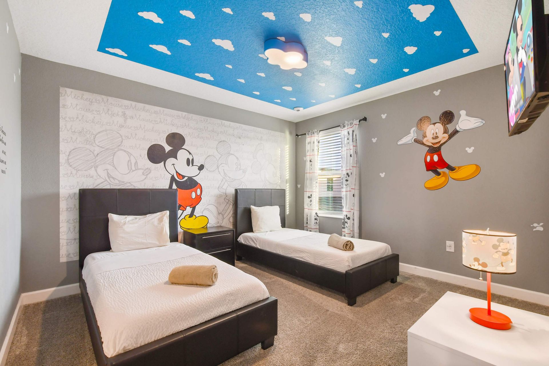 Charming Mickey Mouse-themed bedroom with playful accents.