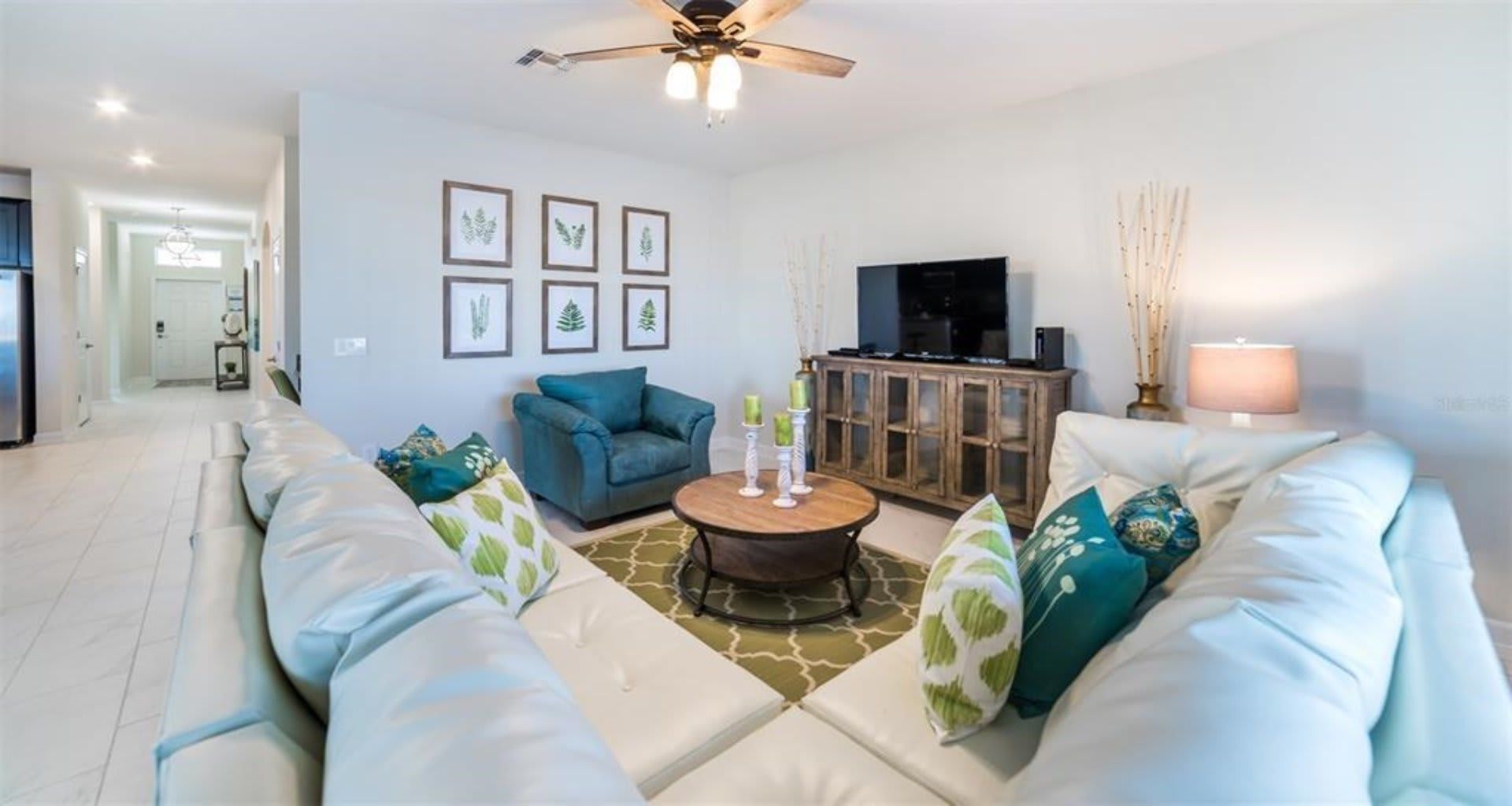 Enjoy quality time with loved ones in our inviting living room, offering a cozy space for relaxation.