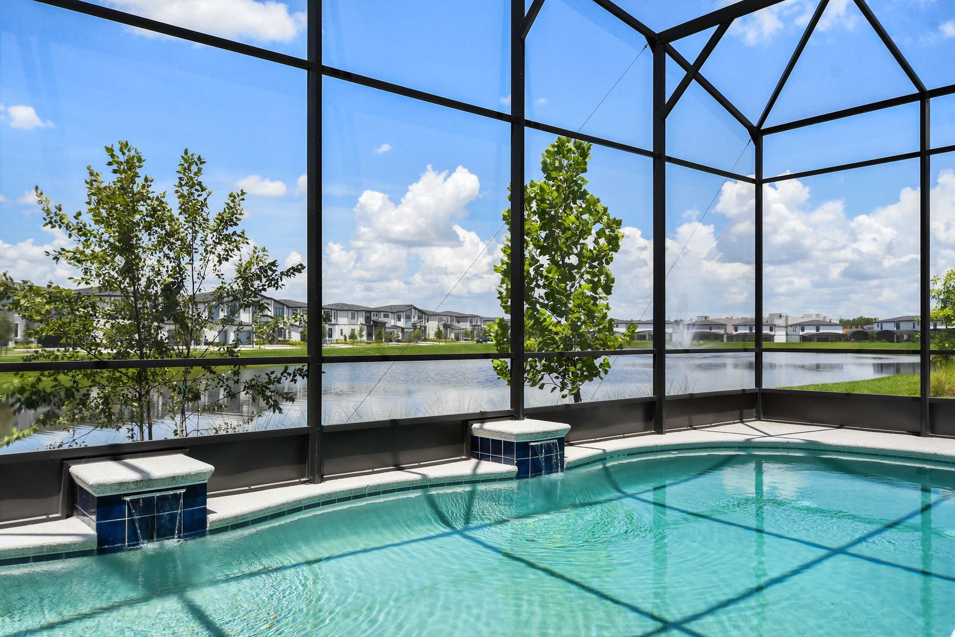 Relax in the spacious outdoor pool area, featuring a private swimming pool and jacuzzi with stunning views.