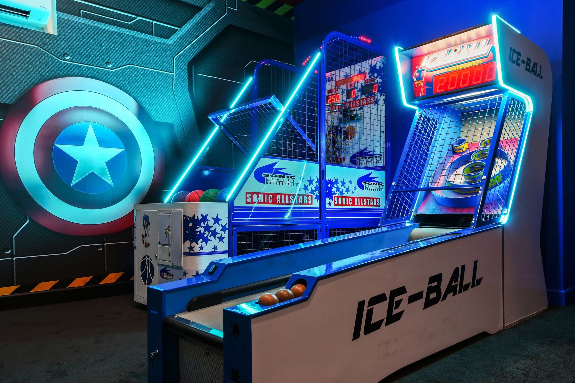Neon-lit arcade room with basketball shootout and skee-ball for nonstop fun.