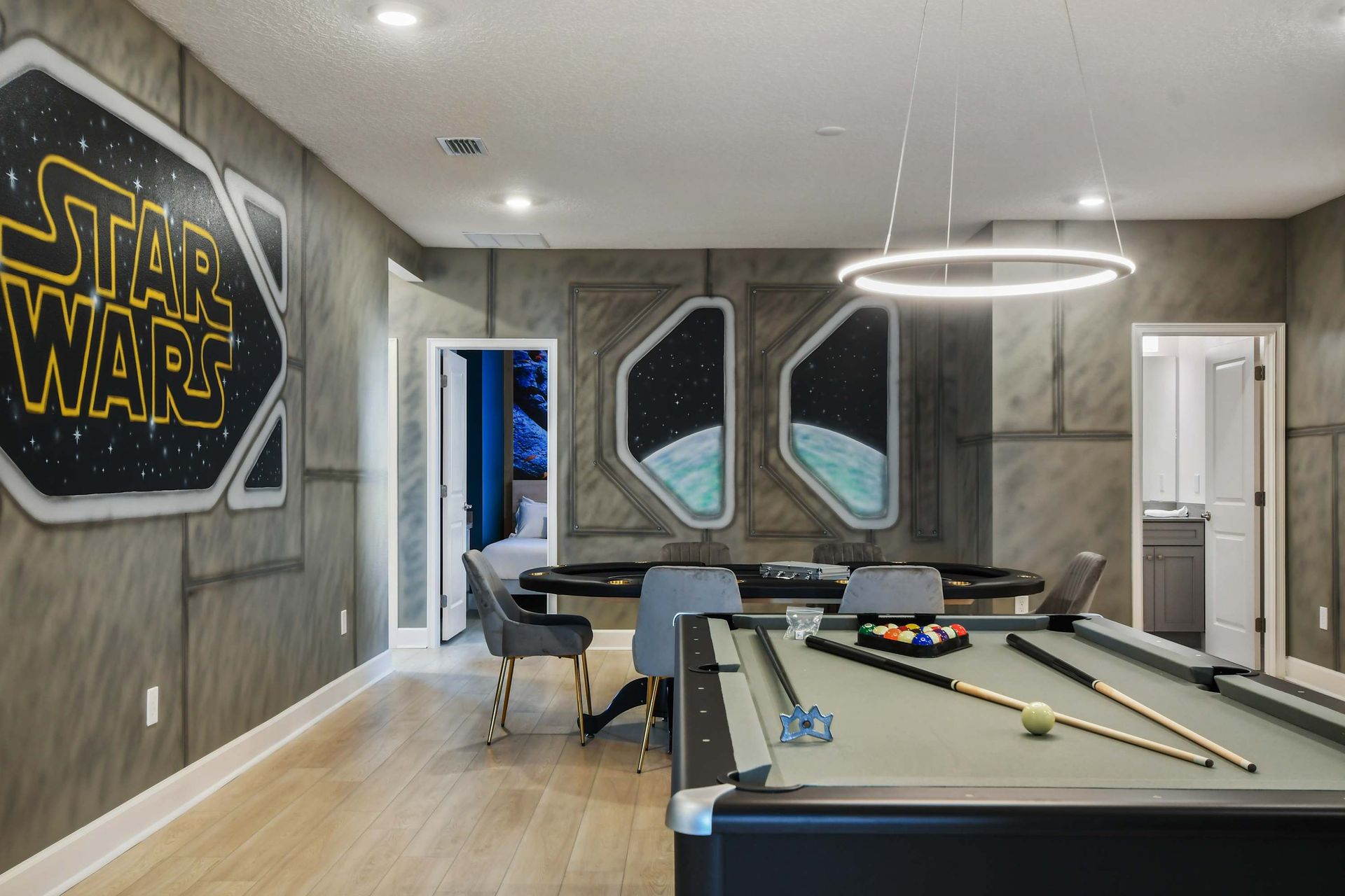Galactic game room with pool, poker table, and Star Wars-themed adventure.